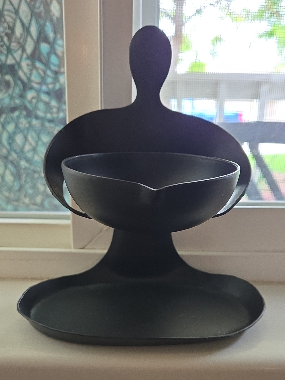 Black Metal Sculptured Figure Holding a Bowl with Legs as a Tray